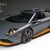 A grey and orange Automobili Lamborghini model by Schiffer Publishing, Ltd. is displayed in a studio, exuding luxury, with "Murciélago LP 650-4 Roadster" and "2009" visible in the background.