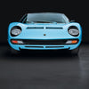 A front view of the blue Automobili Lamborghini Special Edition from Schiffer Publishing, Ltd., shown against a black background with its headlights, grille, and windshield visible—a true icon among luxury sports cars.