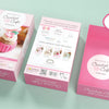 Three pink boxes labeled "Crochet Cafe Amigurumi Kit Cupcake" by Schiffer Publishing, Ltd. are shown. Each beginner kit includes all materials and instructions needed to crochet one cupcake, with a sample cupcake image on the box.