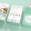 Three mint-green Crochet Cafe Amigurumi Kit Hot Cocoa boxes from Schiffer Publishing, Ltd. are shown: front, back, and open. The front features a crochet mug with heart; the back lists kit contents. Pink label: all supplies included!.