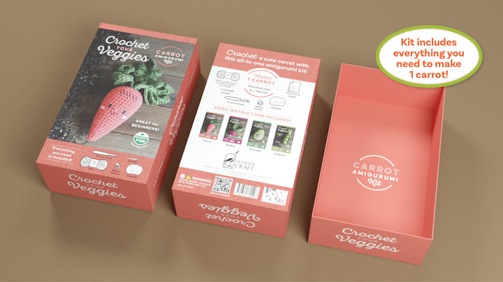 Three coral-pink boxes of the Schiffer Publishing, Ltd. Crochet Your Veggies Amigurumi Kit Carrot display a photo of a crocheted carrot, list kit contents and instructions, and reveal all materials needed for beginners to crochet one carrot.