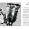 A black-and-white photo of race car driver Tazio Nuvolari smiling beside a large trophy features on "Lords of Speed" by Schiffer Publishing, Ltd., with a tribute honoring his Formula 1 legacy to the right.