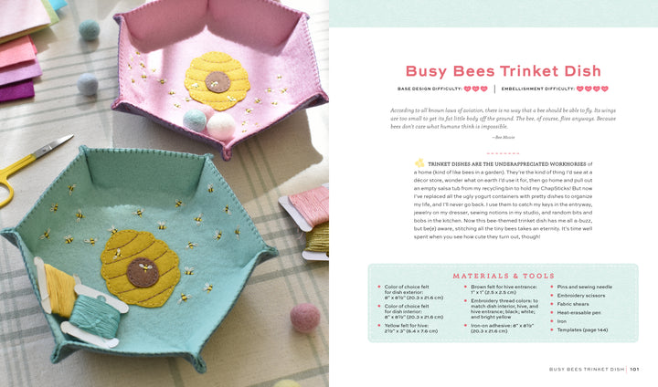 HeartFELT Crafts to Make and Give by Schiffer Publishing, Ltd. features pink and teal felt hexagon trinket dishes with embroidered beehive and bee designs—perfect beginner projects, pictured with thread, scissors, and felt on a light surface.
