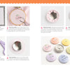 A step-by-step photo guide from Schiffer Publishing, Ltd.'s "Stitching Super-Cute Food Kawaii Style" shows how to prep fabric, stitch cherry faces, assemble, and finish pastel food magnets—with a tip that magnets stick to the back.