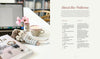 A laptop, a coffee mug, pink flowers in a vase, an amigurumi animal, and the "Sweet and Simple Amigurumi Friends" crochet book by Schiffer Publishing, Ltd. rest on a white table. An "About the Patterns" page is open on the right.