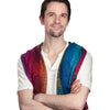 A man with short brown hair and light stubble stands with arms crossed, smiling slightly, wearing a white shirt and a colorful Patch Tarot-inspired scarf. He is against a plain white background. Patch Tarot by Schiffer Publishing, Ltd.