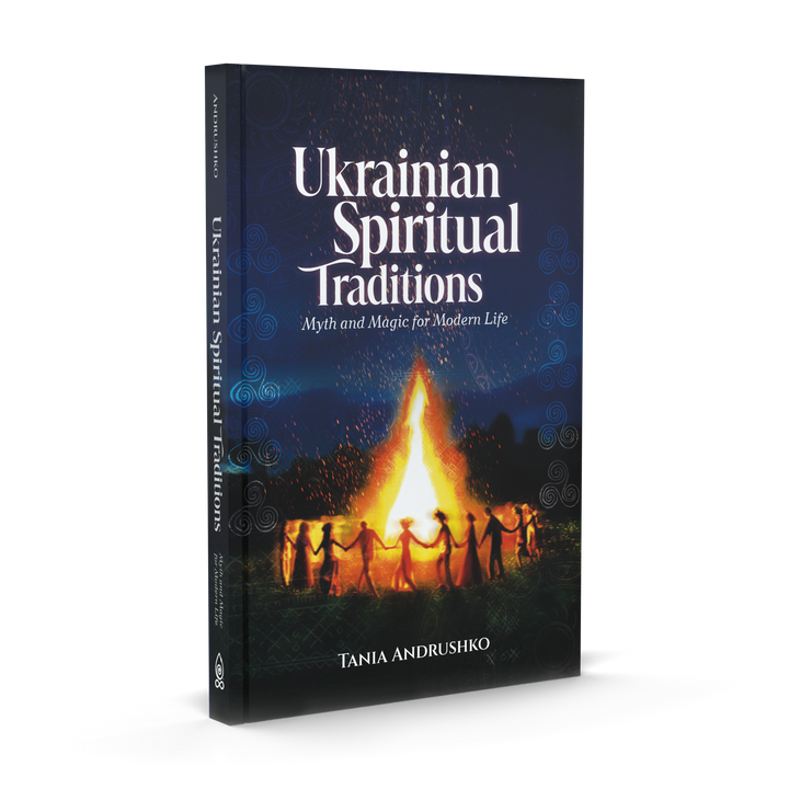Book cover of Ukrainian Spiritual Traditions by Schiffer Publishing, Ltd., showing people dancing in a circle around a bonfire at night, celebrating seasonal rituals under a glowing dark blue sky.