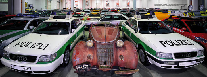 Audi's Historic Fleet by Schiffer Publishing, Ltd. showcases vintage and colorful cars, including white and green German police Audis flanking a rusty antique centerpiece.