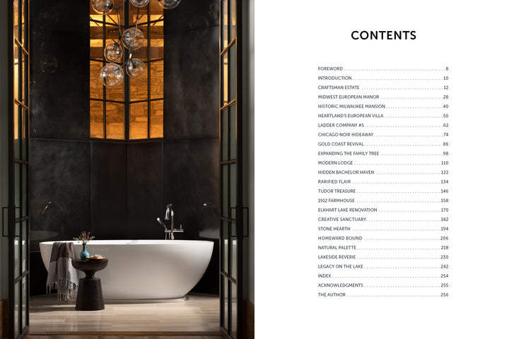 A freestanding white bathtub graces a luxurious bathroom with dark walls in this Midwest Home by Schiffer Publishing, Ltd., featuring a tall window, globe lights, side table, and a contents list shown on the next page.