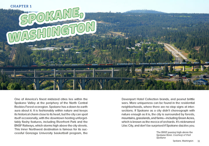 A highway bridge with cars and a train crosses a green valley near Spokane, WA. In the background, trees and cityscape appear under a cloudy sky. "Drinkin' Up the Pacific Northwest" by Schiffer Publishing, Ltd. highlights Spokane's beverage culture.