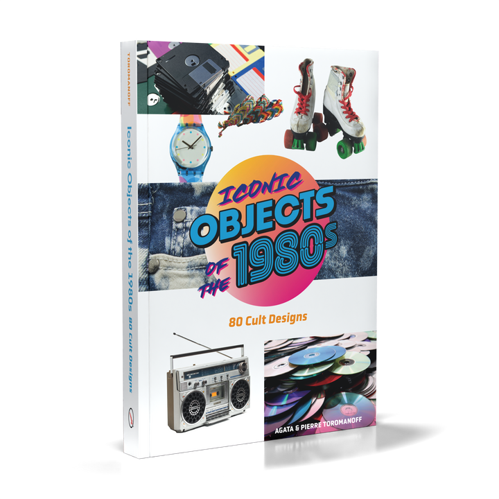 The cover of "Iconic Objects of the 1980s" by Schiffer Publishing, Ltd. features classic 1980s items such as a cassette tape, roller skates, a colorful watch, boombox, vinyl records, and a Rubik’s Cube.