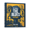 Book cover of The Story of the Blues in 50 Songs by Schiffer Publishing, Ltd., features a vintage microphone and illustrated blues legends in blue and yellow, showcasing the history of blues through 50 classic songs.