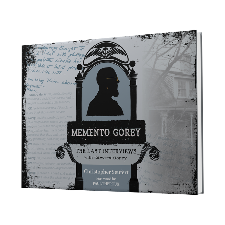 The book cover for Memento Gorey by Schiffer Publishing, Ltd. shows Gorey's silhouette in an ornate frame with handwritten notes and a faded house, capturing the rare interview atmosphere of Edward Gorey’s last conversations.
