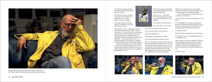 A bearded man in a yellow jacket sits on a blue couch, hand on forehead, holding glasses. Opposite, text and photos from Edward Gorey interviews highlight his unique documentary session in "Memento Gorey" by Schiffer Publishing, Ltd.