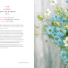 An open book spread of "Backyard Cutting Garden" by Schiffer Publishing, Ltd. shows info about Love-In-A-Mist on the left and a close-up of blue and white blooms with airy foliage on the right, against a softly blurred background.