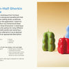 Three sculptural candles—tall blue, medium green, and small red—stand upright on a cream background. On the left is Candle Whimsy, a beginner’s guide to candle making from Schiffer Publishing, Ltd., with instructions displayed.