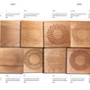 Stamping on Wood by Schiffer Publishing, Ltd. features twelve wooden tiles with unique, laser-engraved geometric patterns—each displaying distinct circular or spiral motifs inspired by traditional and modern stamping techniques.