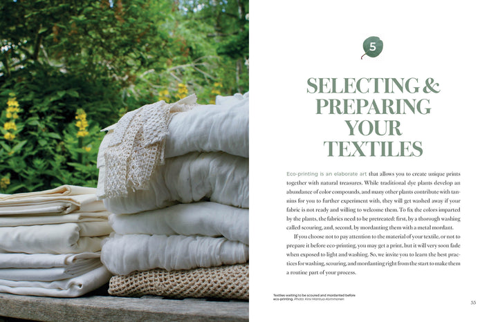 A stack of white and beige fabrics rests on a wooden surface amid greenery and yellow flowers. On the right, text reads, “Selecting & Preparing Your Textiles for Eco-Printing.” Product: Eco-Print by Schiffer Publishing, Ltd.