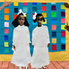 Two young girls in white dresses stand on a wooden floor with a colorful tapestry quilt behind them. Four hands point toward the girls. Image from "Tapestry Talking" by Schiffer Publishing, Ltd.