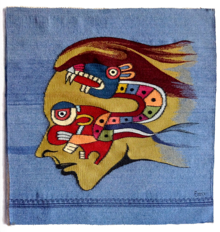 Tapestry Talking by Schiffer Publishing, Ltd. features a woven design of a stylized human profile with a colorful serpent-like figure emerging from the head, adorned with Aztec or Mayan motifs on blue—a striking example of intricate tapestry craftsmanship.