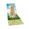 Discover Monuments of the World by Schiffer Publishing, Ltd.—an illustrated pop-up featuring playful people and animals exploring famous landmarks like the Leaning Tower of Pisa, perfect for seek-and-find fun under a bright blue sky and on green grass.