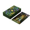 A stack of The Liminal Woods Oracle cards by Schiffer Publishing, Ltd. features floral backs; one card is face up, displaying a tree, snake, and mushrooms on dark green with "The Portal" title.