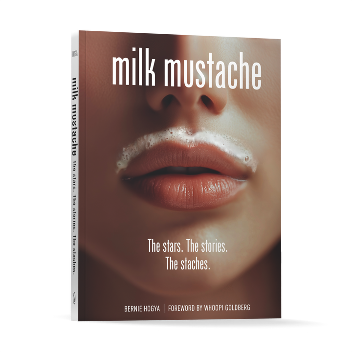Milk Mustache by Schiffer Publishing, Ltd. explores pop culture ads, featuring a close-up of lips with a milk mustache on the cover and stories by Bernie Hogya, with a foreword by Whoopi Goldberg.