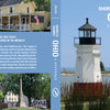The book "Shores & Islands Ohio" by Schiffer Publishing, Ltd. features a cover with a white lighthouse near Lake Erie Shores & Islands, sandy beach, people, trees, and houses; back includes photos of Midwest vacation destinations and local buildings.