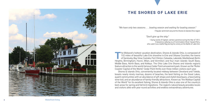 A serene Shores & Islands Ohio getaway by Schiffer Publishing, Ltd.—boats docked along the shore, green trees behind, and white waterfront buildings with red roofs beneath a lightly clouded sky.