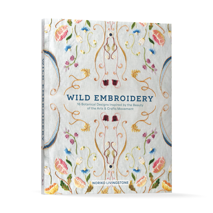 The cover of Wild Embroidery from Schiffer Publishing, Ltd. displays vibrant, detailed nature-inspired embroidery designs with the title and subtitle in blue and gold on a light fabric background.