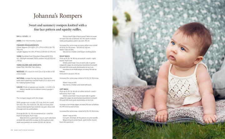 A baby sits outside on a gray blanket, wearing a cream romper inspired by KlompeLOMPE patterns from "Baby Knits from Norway" by Schiffer Publishing, Ltd., with lace and ruffles, gazing upward while white flowers blur in the background.