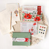 The Watercolor the Easy Way Paint-Your-Own Watercolor Cards Christmas kit by Schiffer Publishing, Ltd. includes a paint set, brush, envelopes, instruction book, and festive holiday cards with printed outlines for easy painting.