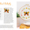 The Sunny Stitches Embroidery Kit Brilliant Butterfly by Schiffer Publishing, Ltd. displays a yellow and black butterfly in a wooden hoop with colorful floral stitches. Supplies and step-by-step instructions are shown on the page's left side.