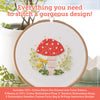 The Sunny Stitches Embroidery Kit Woodland Mushroom by Schiffer Publishing, Ltd. includes everything to stitch a red-and-white mushroom, green leaves, and yellow flowers—perfect for hand embroidery. Supplies are listed below.