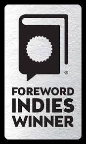 A rectangular silver badge with a black book and seal icon above the bold text "Foreword INDIES WINNER"—a perfect keepsake for fans of Crochet Girls by Schiffer Publishing, Ltd.