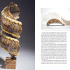 A large, intricate spiral sculpture stands on a wooden base—an inspiring testament to arts entrepreneurship. On the right, two crescent bamboo pieces appear. Below is "Making Good" by Schiffer Publishing, Ltd.