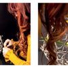 A red-haired woman in a yellow sweater arranges yellow flowers and greenery in a large, round, white basket atop a black surface, inspired by "Perishable Poetics" from Schiffer Publishing, Ltd.—a blend of nature and art.