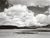 Black and white photo from "Harvey Caplin's Real Cowboys & the Old West" by Schiffer Publishing, Ltd. shows cattle in a corral amid rolling hills, capturing the dramatic scale of American West ranch life.