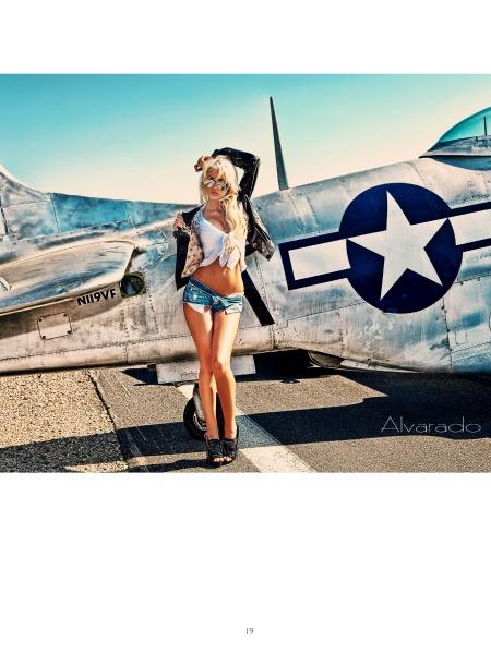 A woman poses in front of a vintage silver airplane, channeling the look from Alvarado's Classic Modern Pin-ups by Schiffer Publishing, Ltd.—a modern take on pin-up style inspired by classic photography.