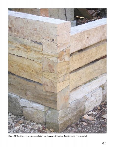 Wood in Traditional Architecture by Schiffer Publishing, Ltd. highlights expert carpentry—timber logs precisely stacked with interlocking notches on a stone foundation, exemplifying traditional architectural methods.