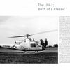 Black-and-white photo of a US Army Bell AH-1 Cobra helicopter on grass, with trees behind. The image is featured in a Schiffer Publishing, Ltd. book chapter detailing the AH-1's significance in military history.