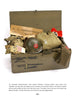 The M-1 Helmet of the World War II GI by Schiffer Publishing, Ltd. showcases GI gear: a helmet, uniform, belt, gloves, a name stencil for Lt. H.S. Vanbenthuyseyn, a folded American flag, and a Nazi armband, evoking authentic combat history.