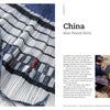 A close-up of a pleated skirt with black, white, and blue stripes appears on the left page; on the right, two people handcraft pleats outdoors in *Threads Around the World* by Schiffer Publishing, Ltd., highlighting heritage textile crafts.