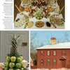 A lavish table of fruits, nuts, and desserts with stacked apples and pineapple is displayed above a red colonial house in snow, as featured in "Christmas at Historic Houses" by Schiffer Publishing, Ltd.