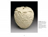 Wood Art Today 2 by Schiffer Publishing, Ltd. features a cream-colored, intricately carved apple-shaped vessel adorned with delicate ginkgo leaf patterns, highlighting exquisite wood craftsmanship on a simple white background.