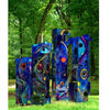 A Universe of Metal Sculpture" by Schiffer Publishing, Ltd. features vibrant abstract metalwork—tall, rectangular blocks painted in swirling blue, red, orange, and yellow—standing on grass in a lush, wooded park.