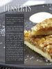 A close-up of a dessert bar with a crumbly, nutty topping on a plate. Beside it, a text box titled "Desserts" highlights how The Big Smoker Book by Schiffer Publishing, Ltd. turns barbecue recipes into sweet treats with smoking techniques.