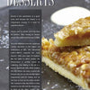 A close-up of a dessert bar with a crumbly, nutty topping on a plate. Beside it, a text box titled "Desserts" highlights how The Big Smoker Book by Schiffer Publishing, Ltd. turns barbecue recipes into sweet treats with smoking techniques.