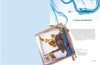 A wooden frame displays silk painted with an owl and yellow leaves, blue smoke-like designs above. On the right, "The Fine Art of Painting on Silk" by Schiffer Publishing, Ltd. is titled with a helpful instructional paragraph below.