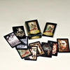 The Lowbrow Tarot by Schiffer Publishing, Ltd. is displayed on a light surface, featuring dark, gothic Lowbrow art. Some cards are fanned out, with the Major Arcana deck box and a stacked deck in the center.